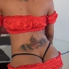 TS Bella Sinatra in red teasing and pleasing plus her curvy body